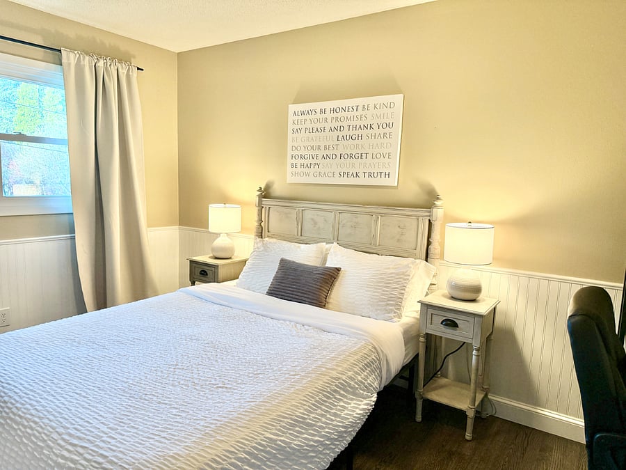 Second bedroom with queen bed and designated work space.