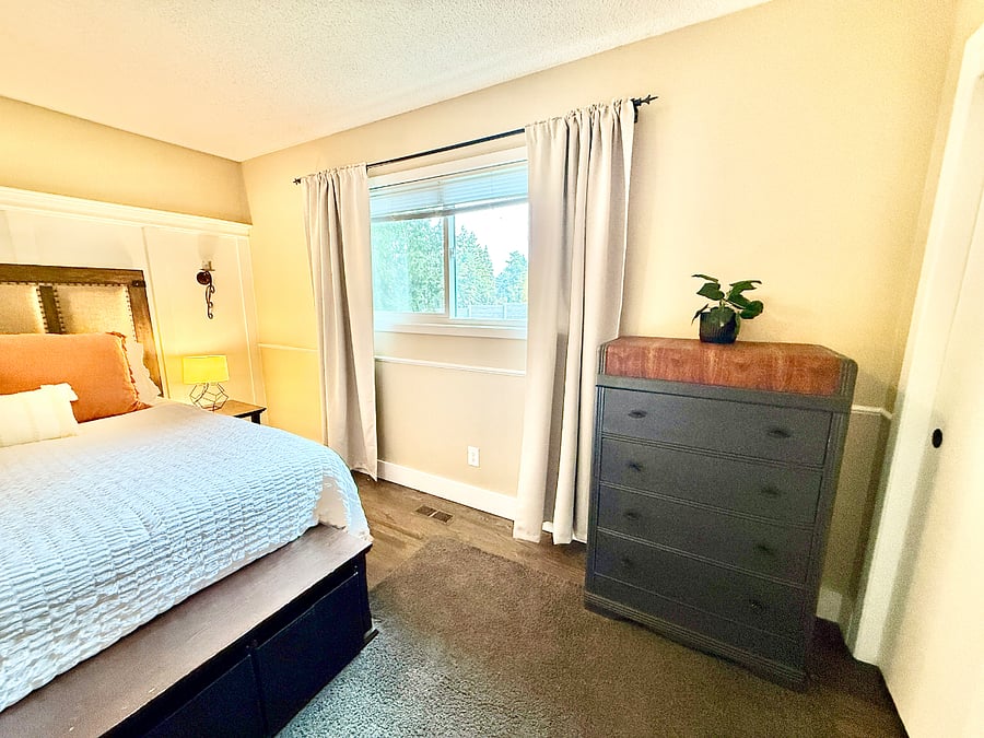 Primary bedroom with queen bed, board and batten wall features, chest of drawers, and beautiful view of large backyard.
Video walkthrough:
https://youtu.be/KUU2CeFw0Gk?si=IB1Gr6XOI5VLr58Z