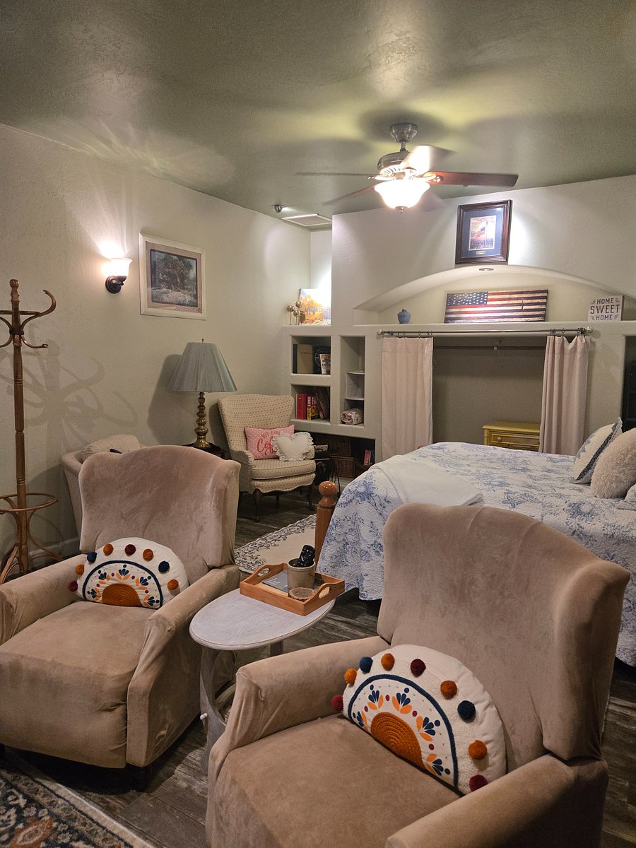 sitting area in front of the bed -