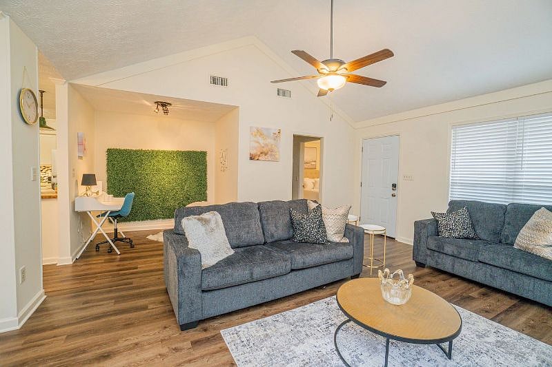 The bright and airy living is a perfect gathering spot