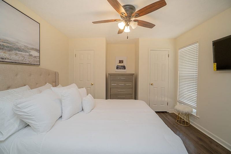 The second bedroom's queen bed is so comforting at the end of a long day of travel