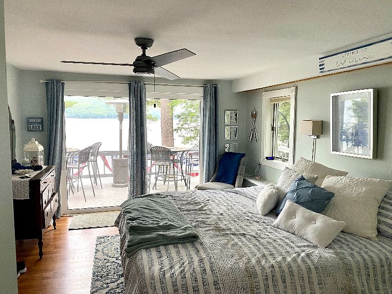 Master Bedroom with sliders opening to the lower Deck level with beautiful views of the lake