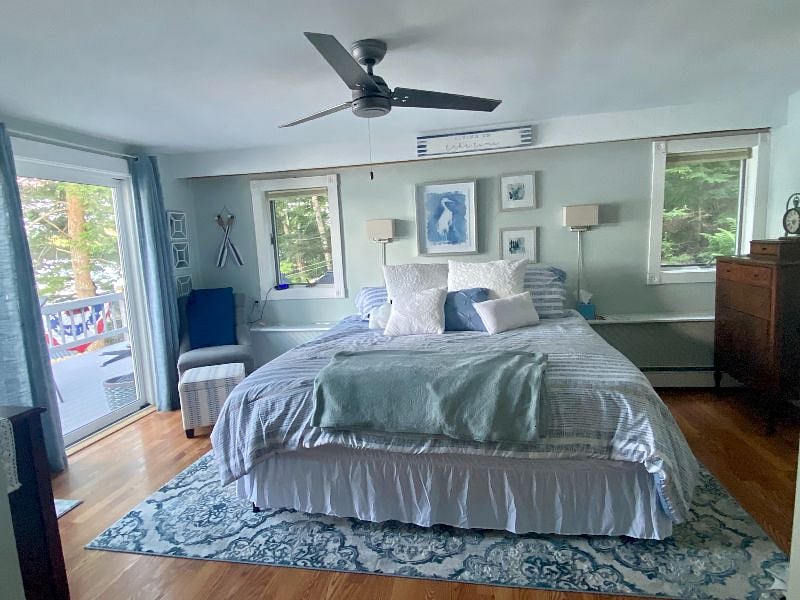 Master Bedroom with sliders opening to the lower Deck level with beautiful views of the lake