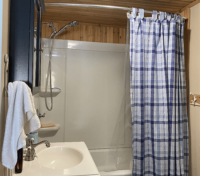 Master bath features two rooms, one for showering or spa tub and a separate room for the toilet.