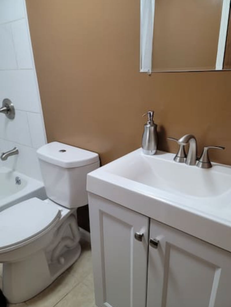 Newly Remodeled Hall Bathroom with Tile shower surround, new bathtub, new low flow toilet and new vanity.