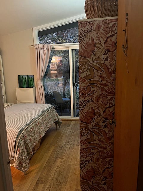 Bedroom 3 with French Doors that opens to Backyard Deck.