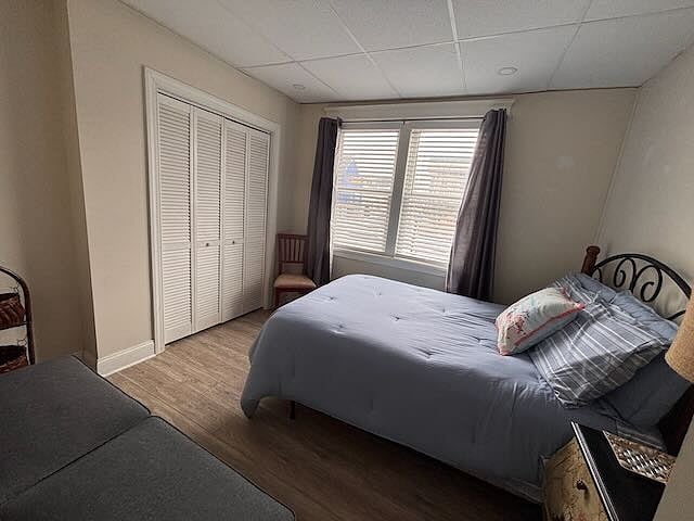 @nd bedroom with full bed and 2 sets of sheets