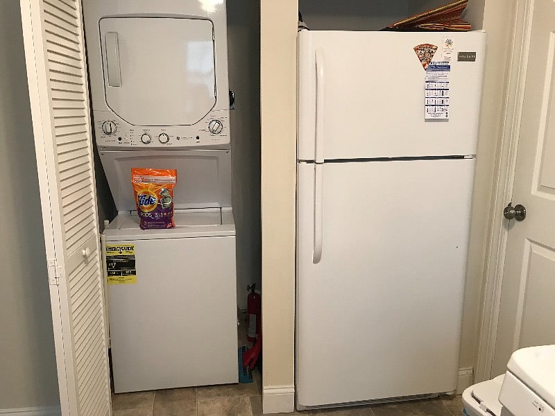 washer / dryer and full sized fridge off of kitchen