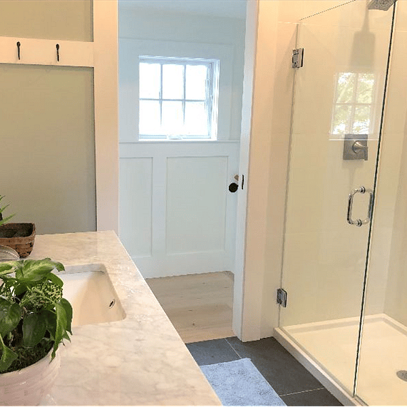 Master Bath off of upstairs hallway has roomy shower with tiled bench.