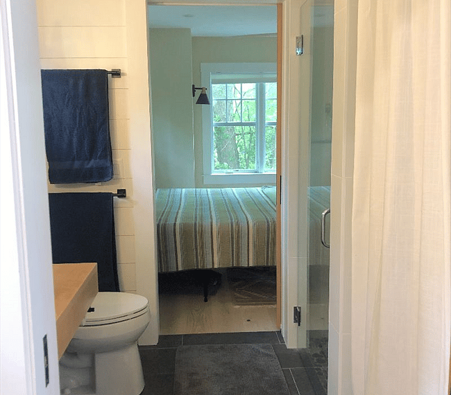 Bath leads to downstairs bedroom.
