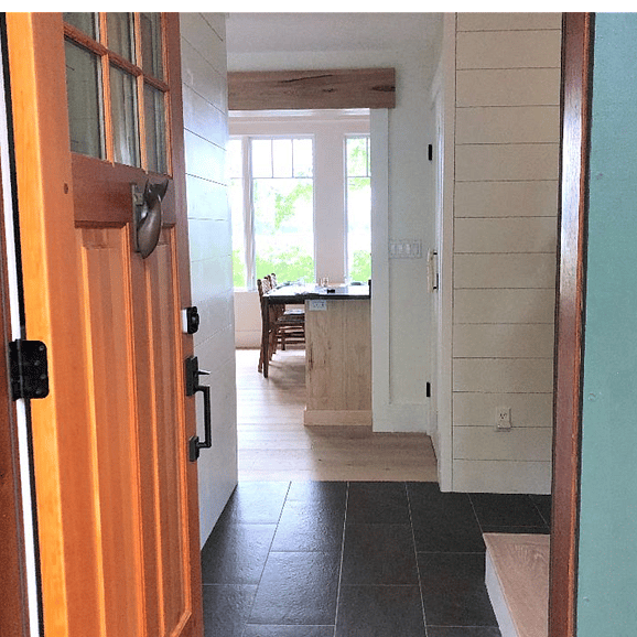 The front hall serves as a necessary mud room where you can remove your muddy, sandy footwear.