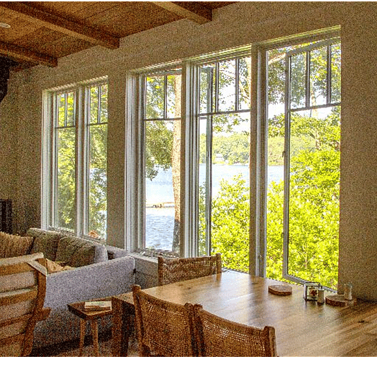 Comfy living area with wood stove, large TV, couch and chairs.