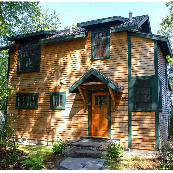 Enter the cottage from a wooded path.