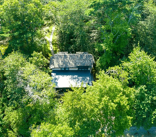 The cottage sits in the middle of a 100 year old camp.
