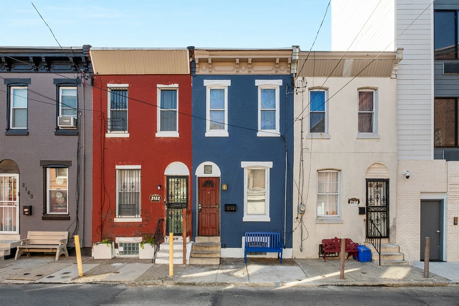 A monochromatic outdoor apartment facade creates a bold, cohesive statement that highlights modern simplicity while enhancing the buildings architectural lines with vibrant or calming tones.