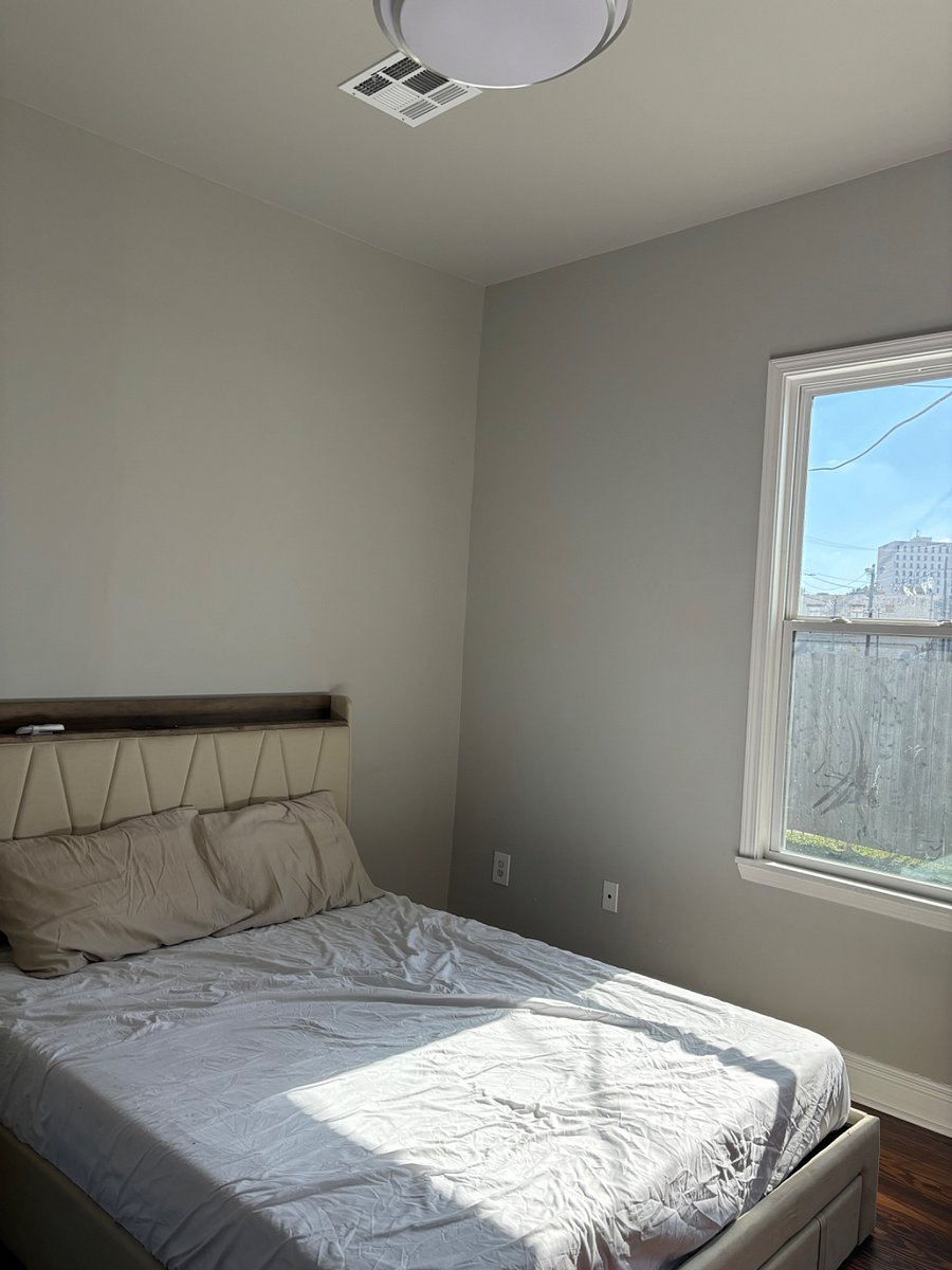 The bedroom is through a large hallway. It features a cozy queen size bed with beauty rest mattress. The current queen size bed is a sleigh bed, not the one in this photo.