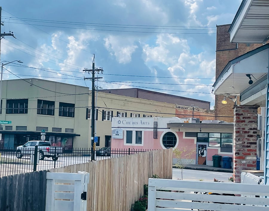 The view from your front door, which opens to a small grassy courtyard, perfect for a small pet or to sit on the bench and enjoy your morning coffee. Walk to many wonderful downtown locations! A rare feature in Lafayette properties!