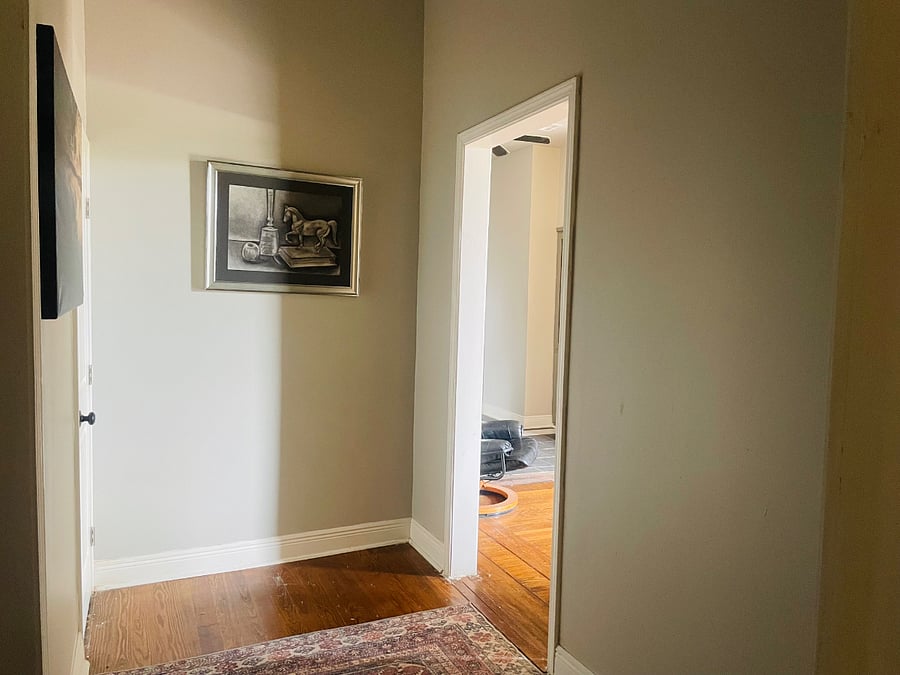 The large hallway connects the living room, bedroom, and bathroom.