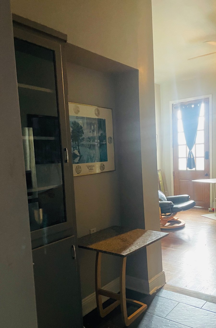 another view from the kitchen facing the large antique entry door