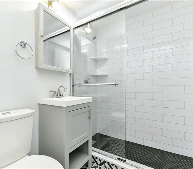 Beautifully renovated bathroom with tiled shower