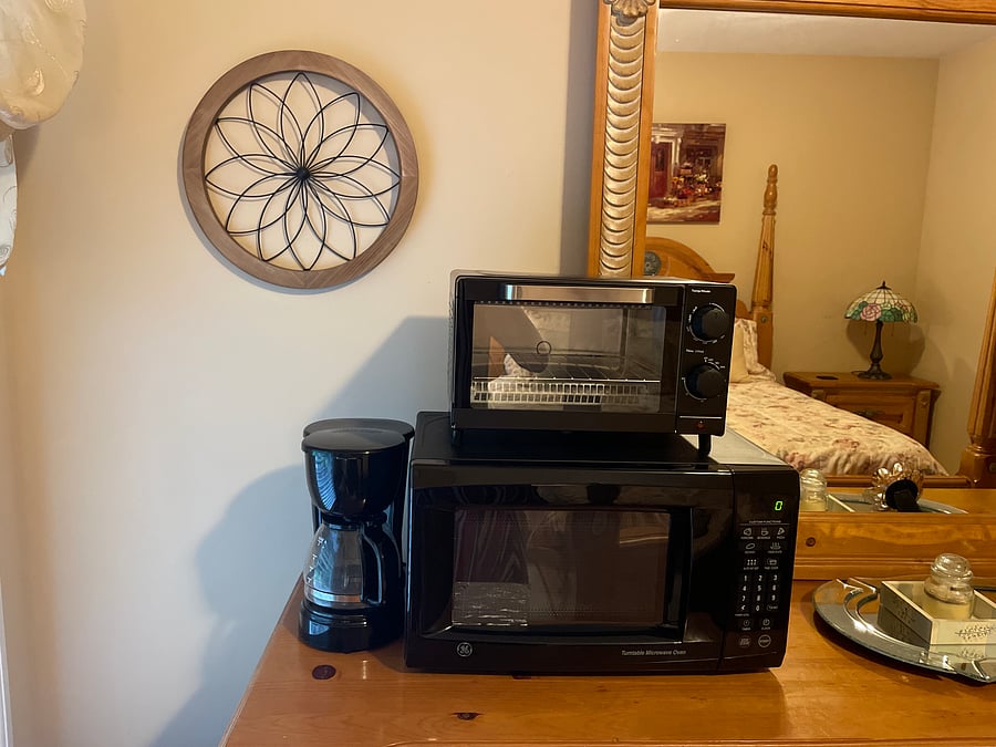 Microwave, coffee and toaster oven is in room with access to full gourmet kitchen
