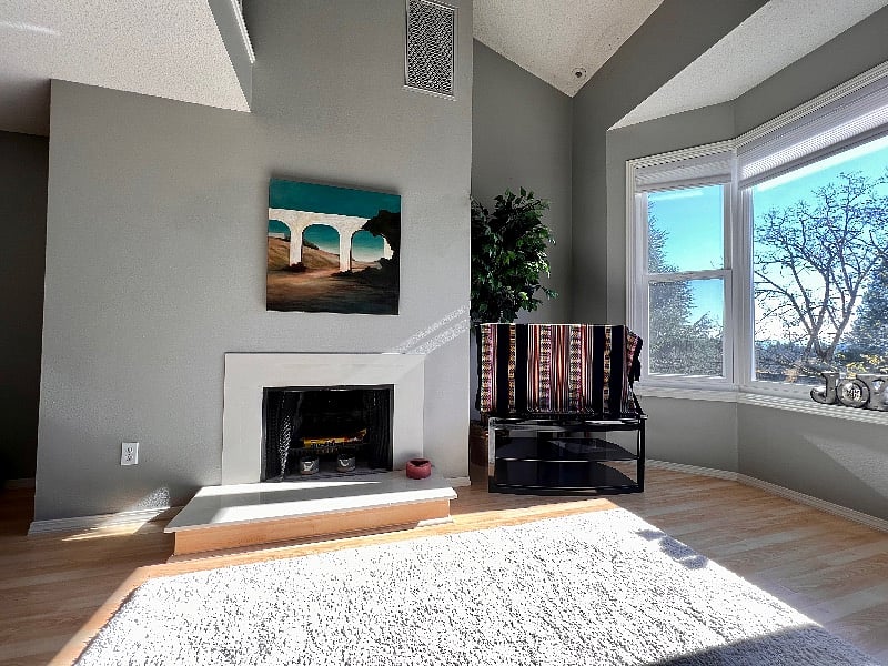 Fire burning fireplace and gas fireplace in back patio.