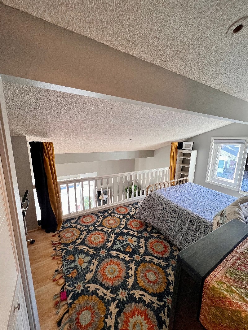 Bright lighted Loft bedroom (double bed) with office desk and chair, dresser, closet and bathroom. Curtains for privacy.