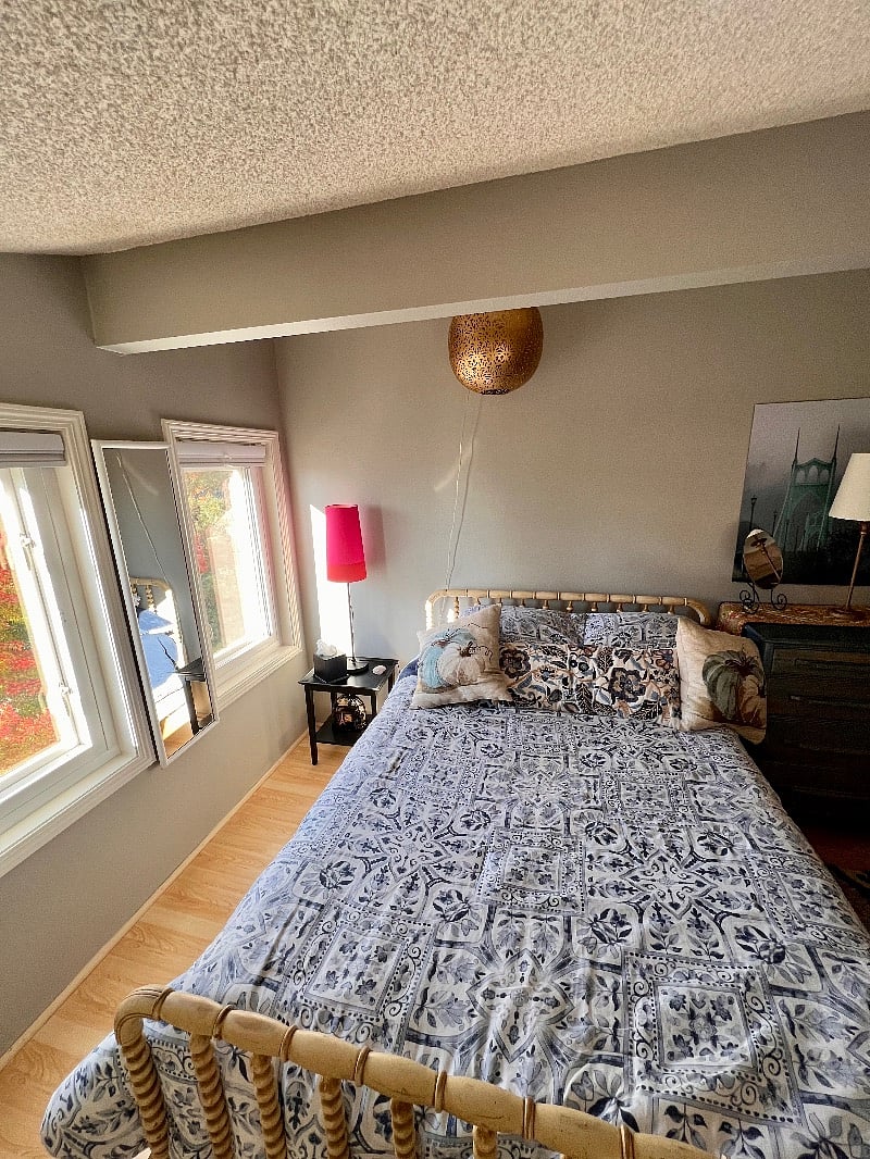 Bright lighted Loft bedroom (double bed) with office desk and chair, dresser, closet and bathroom. Curtains for privacy.