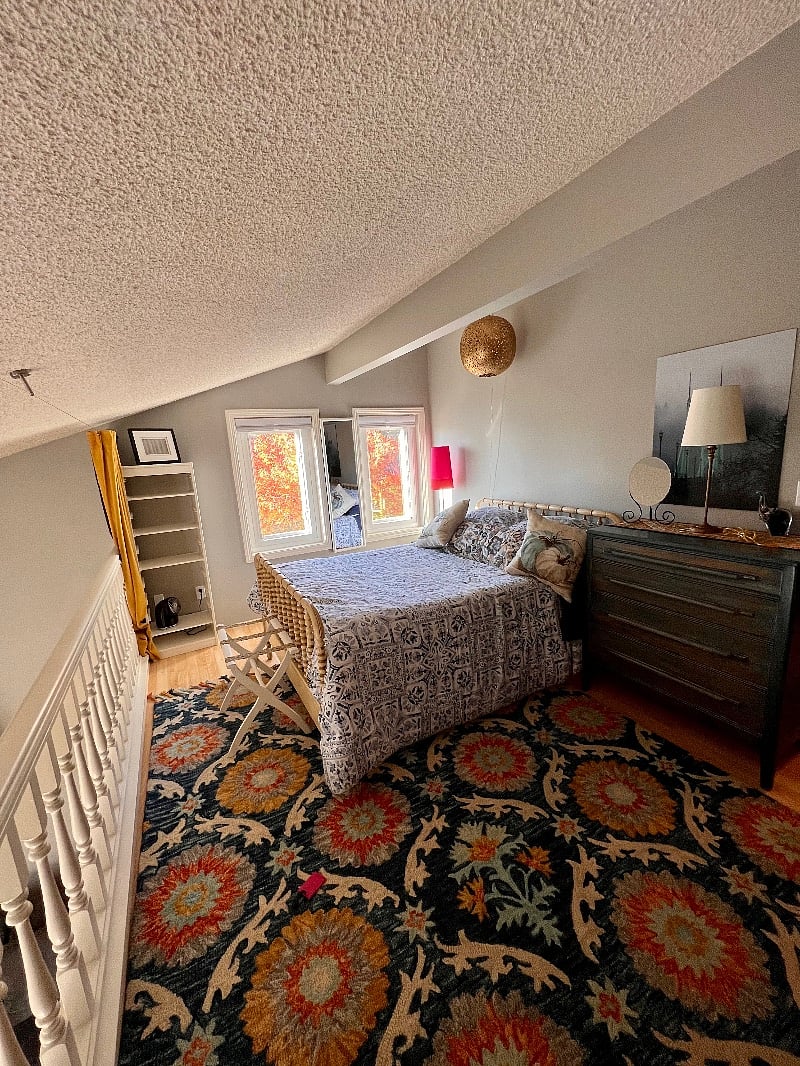 Bright lighted Loft bedroom (double bed) with office desk and chair, dresser, closet and bathroom. Curtains for privacy.