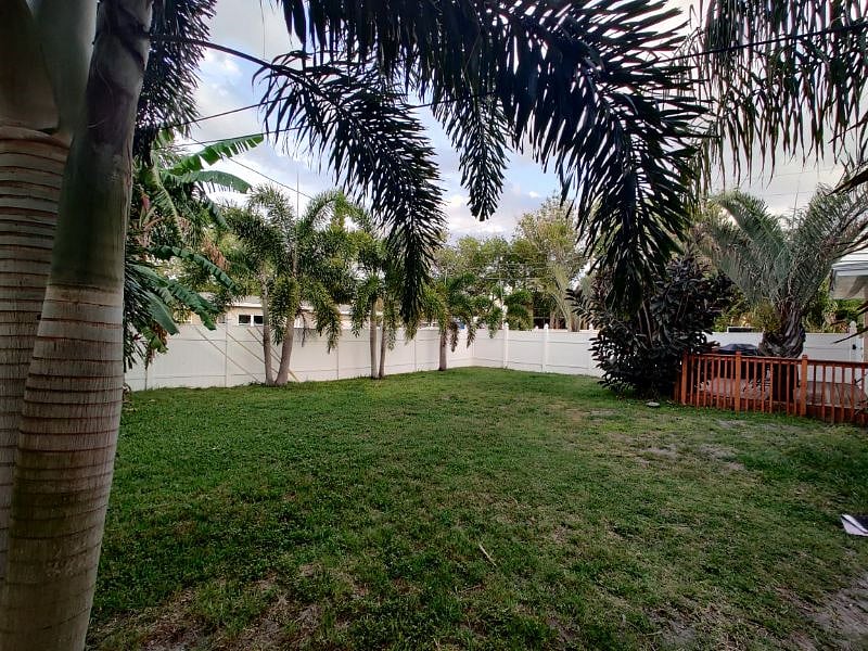 Large fenced back yard, with additional deck and gas grill.