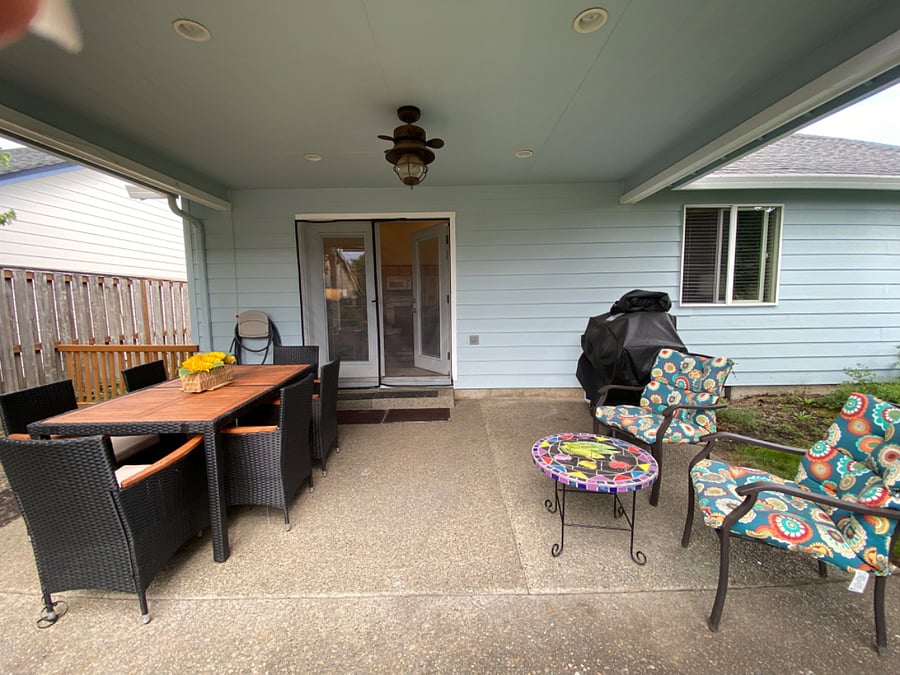 Covered Patio with outside dining/seating and bbq