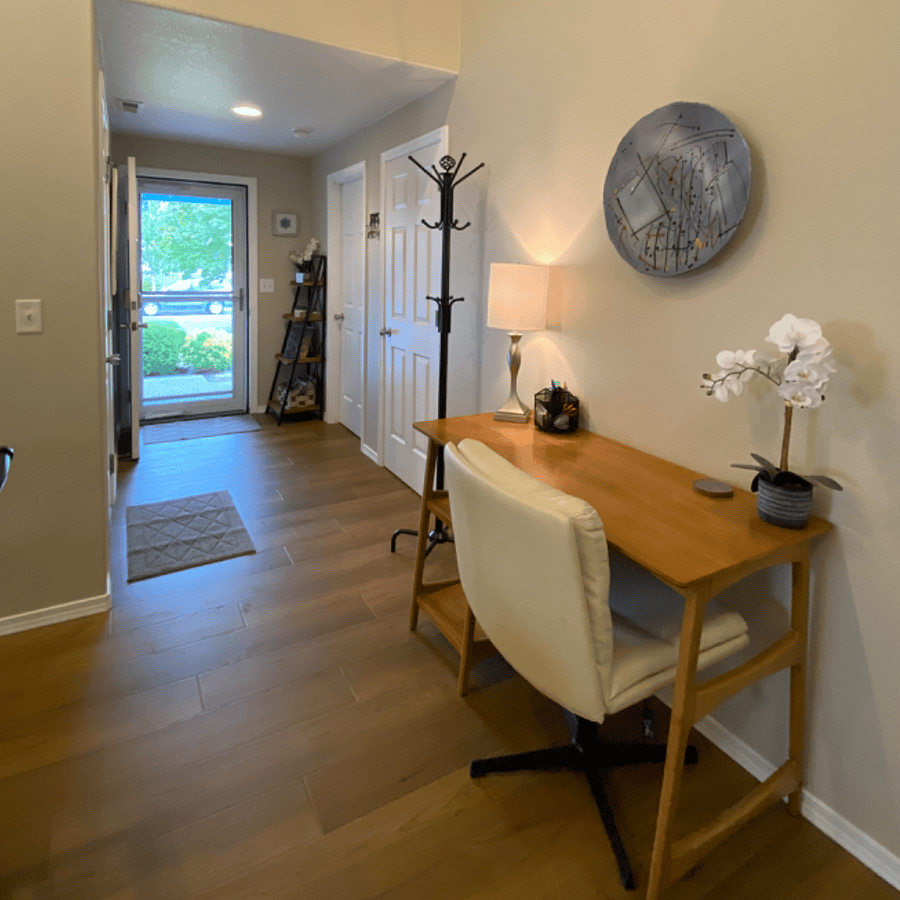 Bright entry way with work desk.