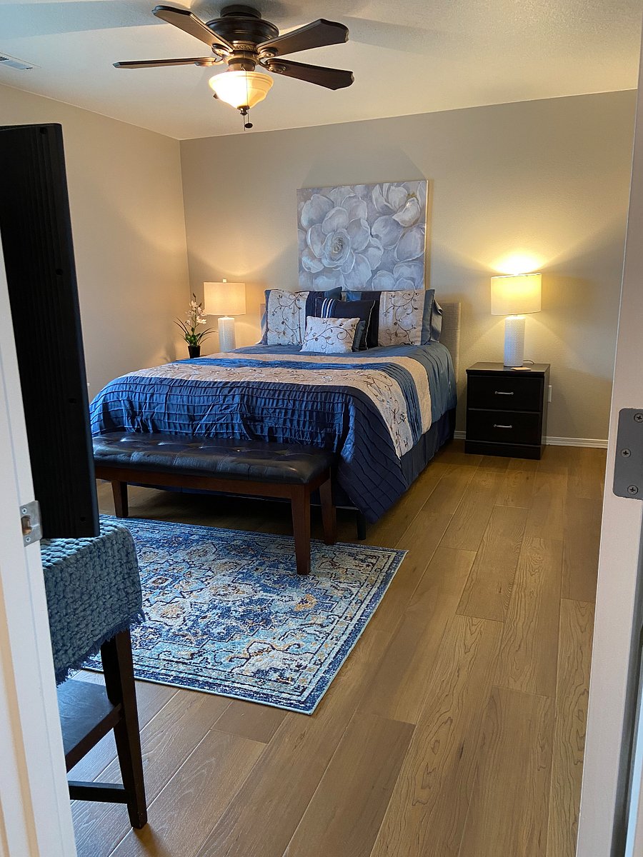 Master bedroom ensuite with queen bed and smart tv.