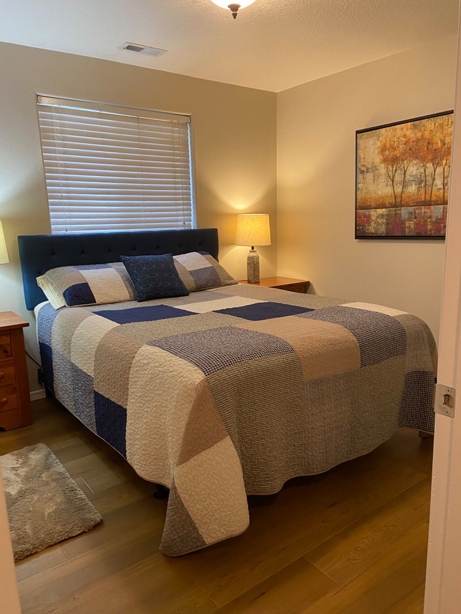 Smallest bedroom with queen bed, closet and small dresser