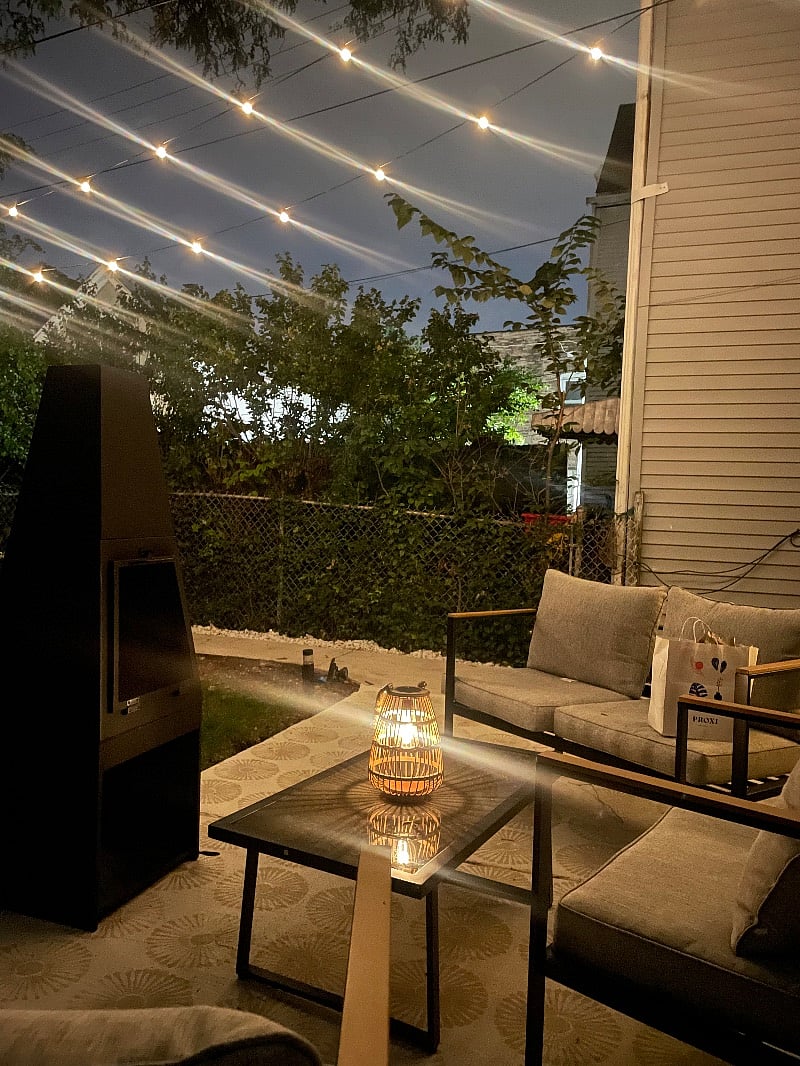 Cozy outdoor patio lit by patio lights. *Use is subject to weather*