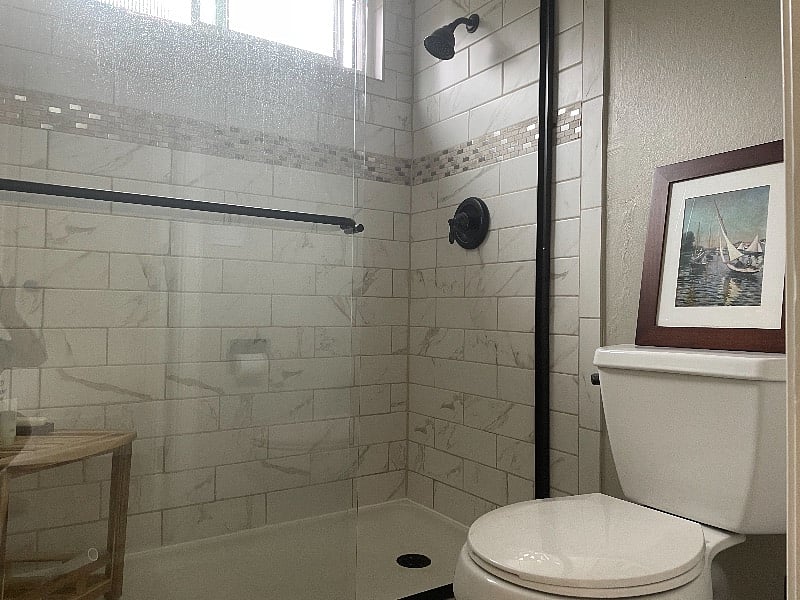 bathroom with a walk-in shower