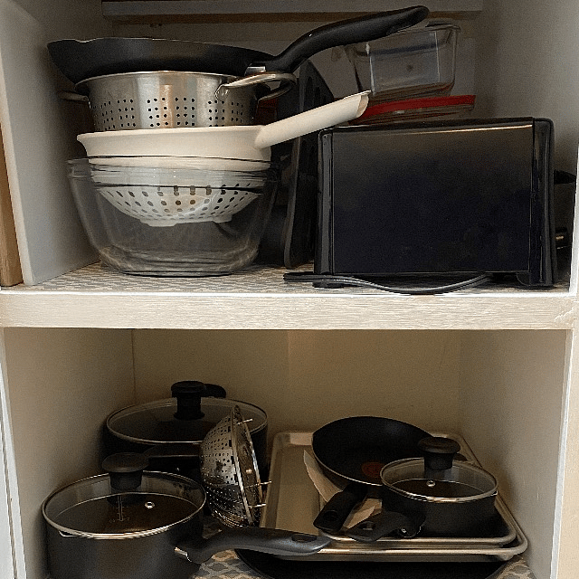Toaster, colander, mixing bowl, storage containers, pizza pan, baking sheets