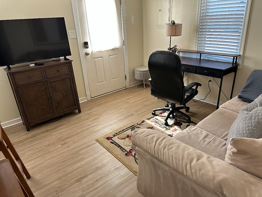 Common room with TV and desk, and sofa
