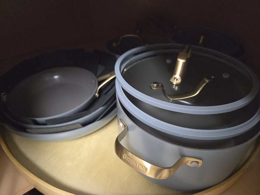 Easy lazy susan storage for 11 pots and pans, casserole dishes, salad spinner, pie plates etc