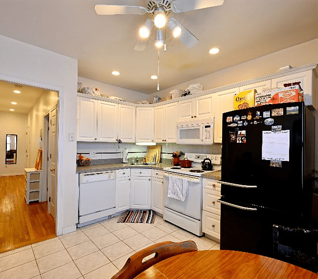 Kitchen with pots, pans, utensils, pour over coffee maker, toaster oven, blender, food processor, hand mixer, slow cooker