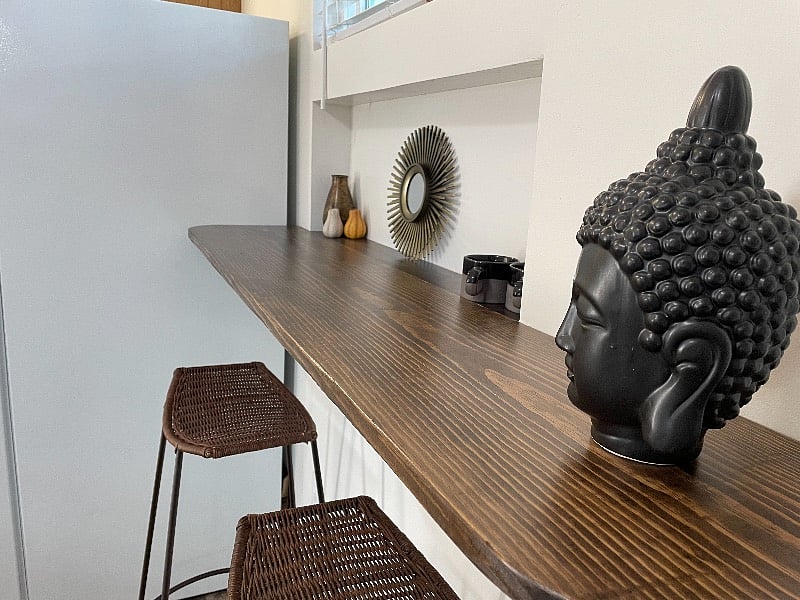 Dining bar can also be used as a workspace and you can see the TV from here.