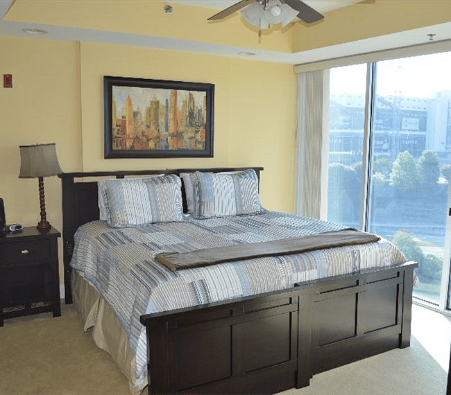 King bed in Master Bedroom.  Huge window with views of Bristol Motor Speedway!