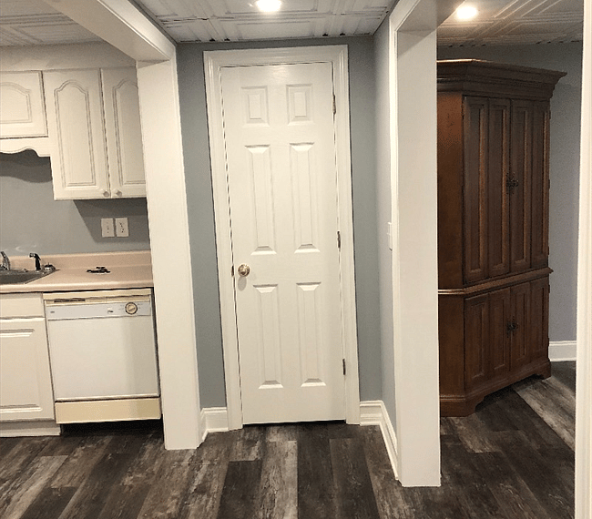 Storage closet between living room and kitchen.
Vacuum, mop, and small ironing board included.