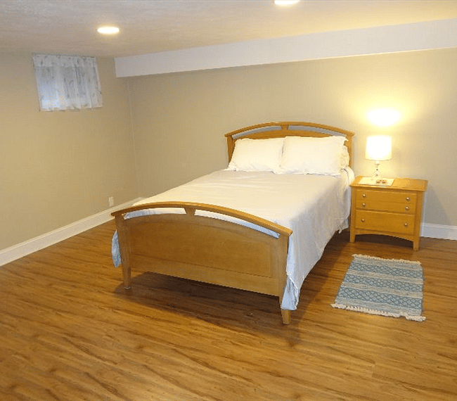 double bed in large bedroom, large closet space