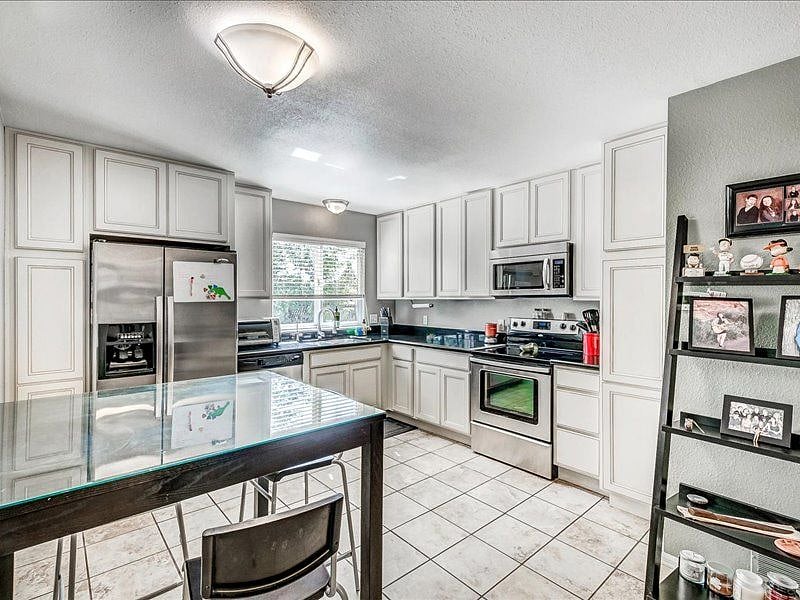 Large shared kitchen with all the essentials, including cookware, plateware, glassware, and silverware