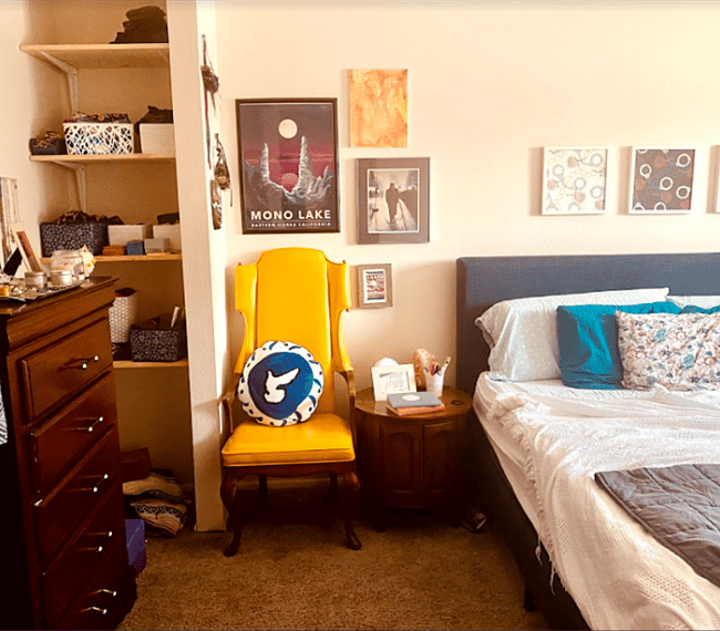 dreamy vintage and feminine modern smaller bedroom with a king sized bed - amazing natural light in the morning with a view of the sunrise.