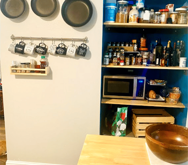 Caphalon pans, mugs for coffee galore, Fully stocked open pantry with spices and a microwave