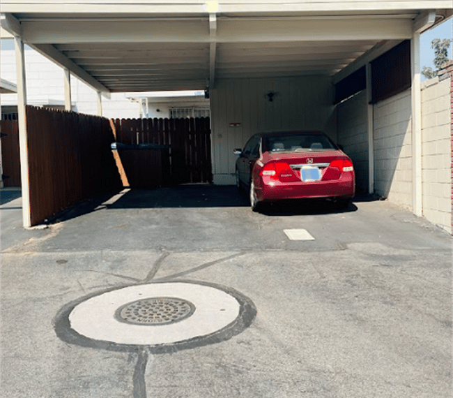 One covered spot for tenants, plenty of street parking as well.