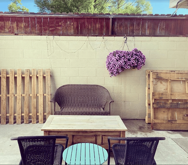 Outdoor private space, back covered patio with a propane grill.
