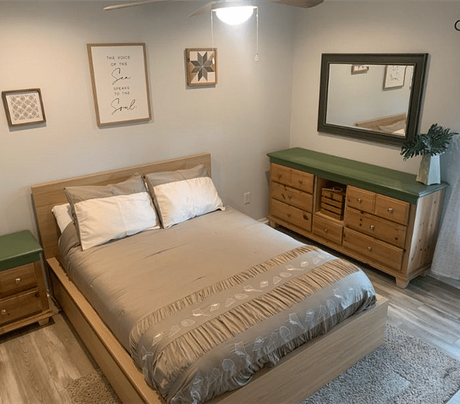 Relax in the guest room on a queen bed and store your clothes in a refurbished dresser. 